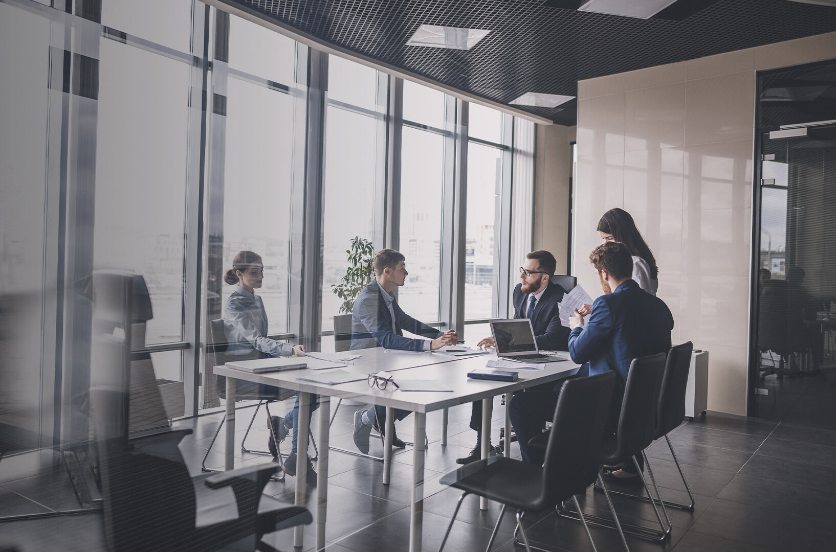 people sitting at a conference table