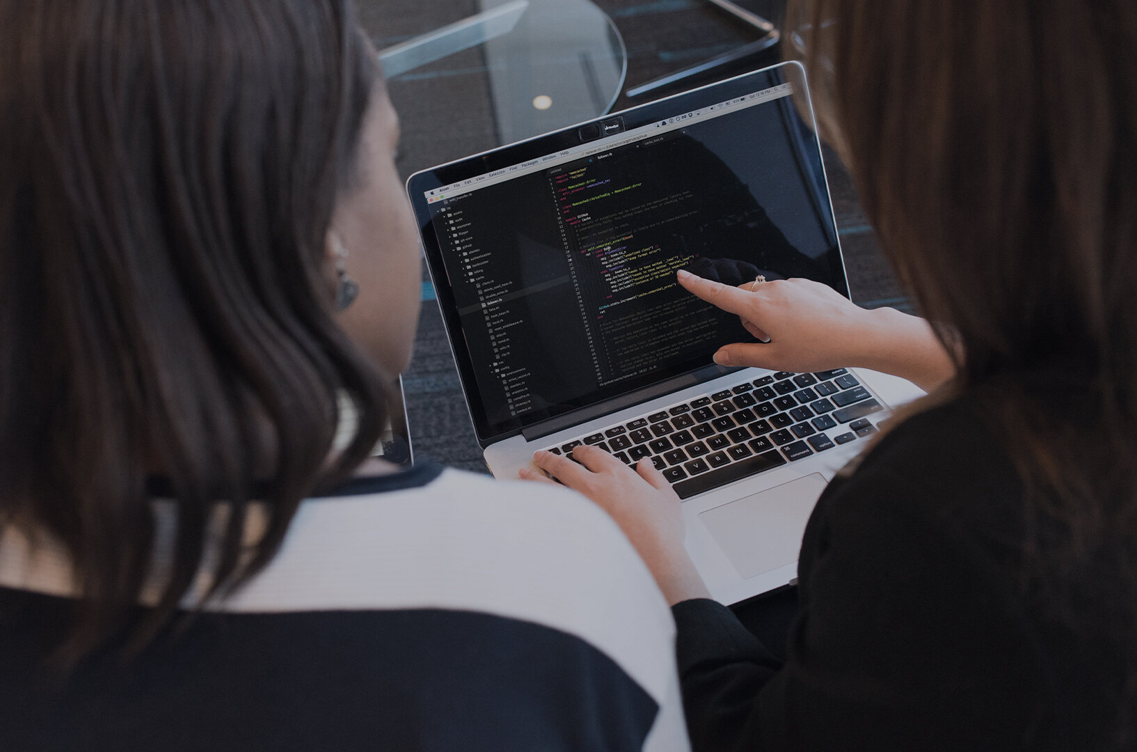 two girls looking at the computer